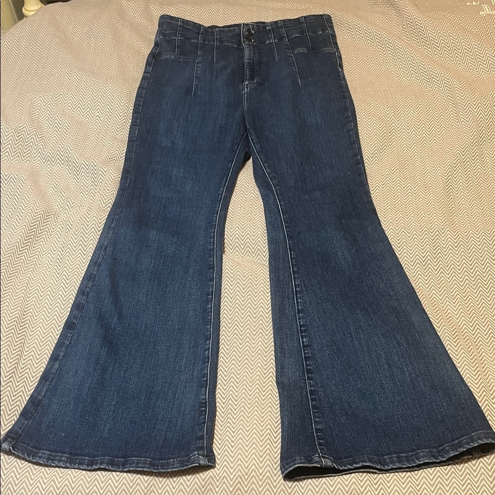 We the Free ultra high rise flare jeans. Dark wash. Stretchy! Size 32. EUC.